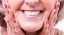 Lady_holding_face_in_hands_smiling